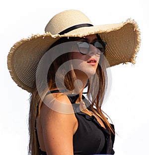 Long-haired girl with straw hat and glasses, bust with white background.