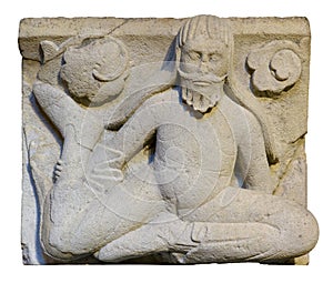 Long-haired man. Metope of Modena Cathedral