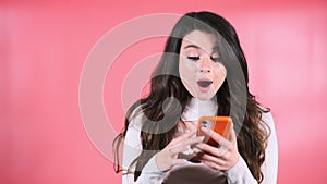 Long-haired woman reads news on Internet on smartphone