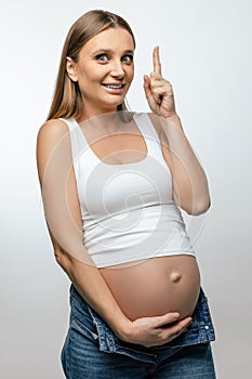 Long-haired young pregnant woman on third trimester