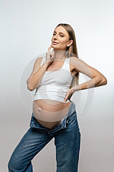 Long-haired young pregnant woman on third trimester
