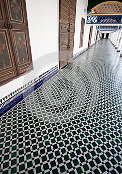 Long hallway with mosaic tiled floor in a Moroccan palace