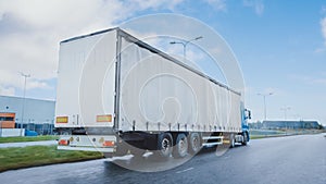 Long Haul Semi-Truck with Cargo Trailer Full of Goods Travels on the Highway Road. Daytime Driving