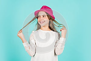 Long and healthy hair. retro girl blue background. happy little kid retro hat. vintage fashion look. summer accessory