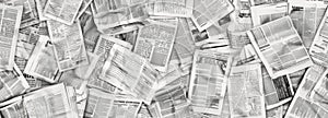 Long horizontal banner with lots of old newspapers on horizontal surface. Background texture. Concept for news and