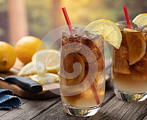 Long island iced tea cocktail with lemon slices