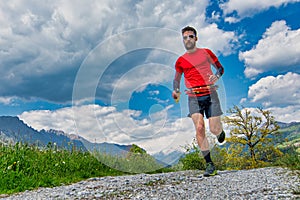 Long-lasting mountain trail runner trains on the dirt road