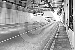 Long lightened tunnel for vehicles. B&W