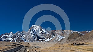 A long lonely road with curves on the tibetan plateau