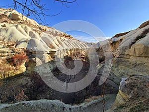 A long and narrow canyon is hiding behind the turn in Cappadocia, Turkey