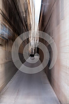 Long narrow passage between urban buildings