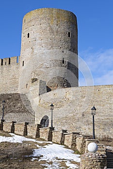 The Long-neck tower of the ancient Ivangorod fortress on a March day. Leningrad region, Russia