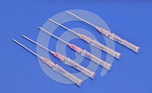 Long Needles used for puncturing artery or vein .