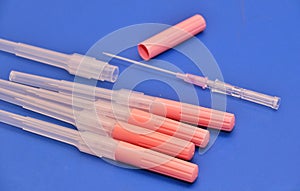 Long Needles used for puncturing artery or vein secured with cap.