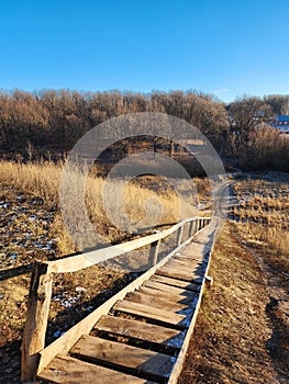 Long old wooden staircase in the village. Rural lifestyle