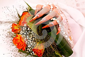 Long orange artificial bridal nails
