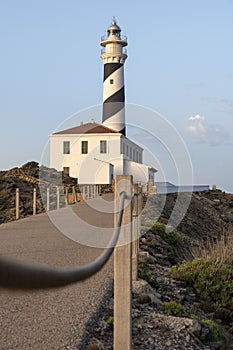 Long path until you reach the Favaritx lighthouse in Menorca in the Balearic Islands. Tourism concept