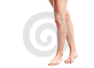 Long pretty woman legs. Isolated on white