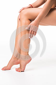 Long pretty woman legs, isolated on white background