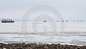 Long queue of ships on the Baltic sea in winter