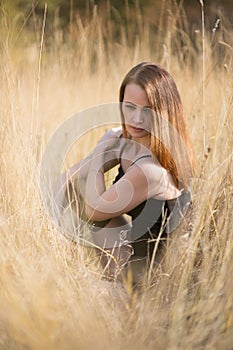 with long red blowing hair outdoors