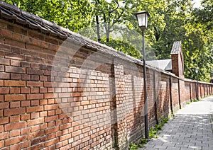 Long red bricks wall