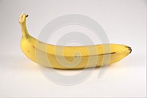 Long ripe banana on white background