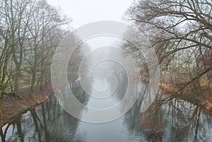 Long river disappearing in fog