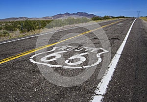 Long road with a Route 66 sign painted on it