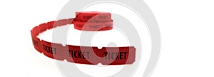 Long Roll of Red Tickets on White background for Entry Into Event or Performance