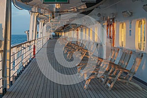 A long row of empty deck chairs