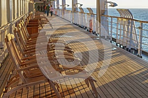 A long row of empty deck chairs