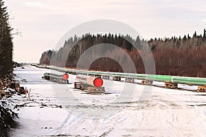 A long row of pipeline being pieced together photo