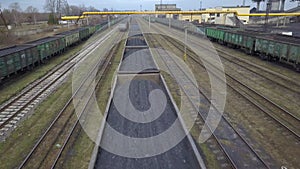 Long row of train cargo cars loaded full with fossil fuel coal.