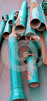 Long rusty green irons were neatly arranged on the floor