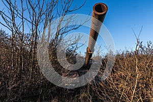 long rusty pipe from a old tank