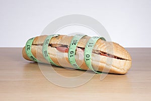 Long sandwich wrapped in measuring tape