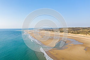 The long sandy beach of La Vieille Eglise in Europe, France, Normandy, Manche, in spring, on a sunny day