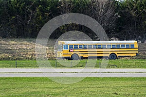 Long School Bus On An Empty Road