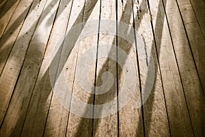 Long shadow on wood floor