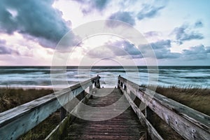 Long shot of a boardwalk leading to a beach in Wenningstedt, Sylt, Germany