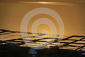 Long shot of saltmine at sunset