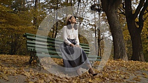 Long shot shot. Stylization under the thirties Black-haired woman in a beret and a long skirt. against the backdrop of