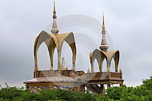 Long shot of two arched domes and a sitting Buddha, at Pha Sorn Kaew, in Khao Kor, Phetchabun, Thailand photo