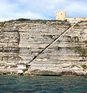 Stairway on the rocks of Aragon Kings in Bonifacio Town in Corsica in France and the Mediterranea sea photo