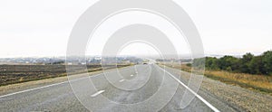 Long straight Highway landscape with moving cars at daytime