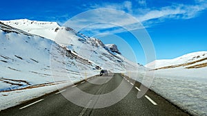 A long straight road and cars in winter