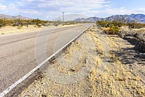 Long, straight road going into the Mojave Desert, California, USA