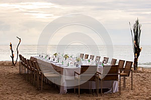 Long table wedding dinner setup.