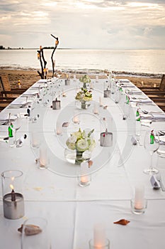 Long table wedding dinner setup.